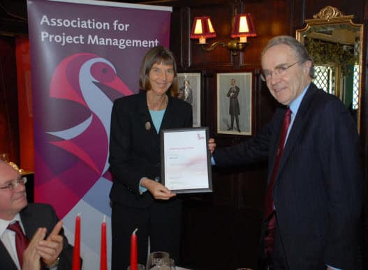Dame Sue Ion her getting her Honorary Fellowship from APM President Martin Barnes at the recent Chairman's lunch