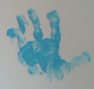 Handprint made by a child in blue paint