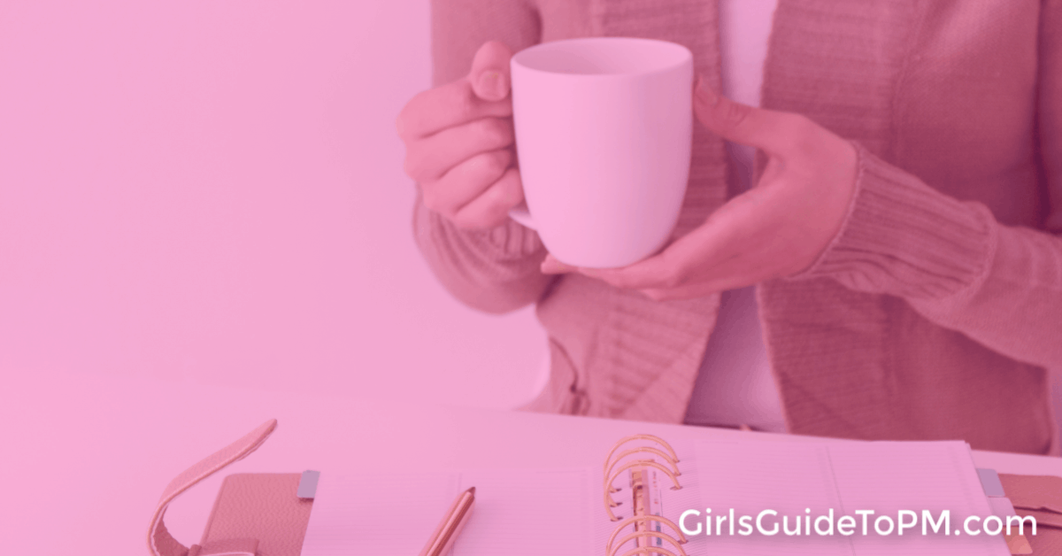 hands holding a coffee mug with pink overlay