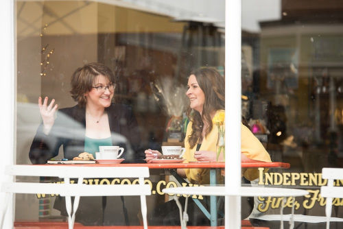 Elizabeth and a colleague having coffee in a cafe