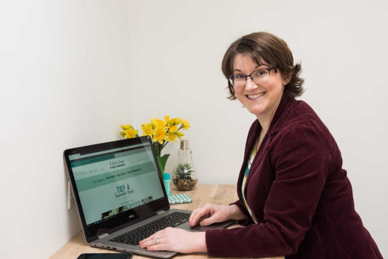 Elizabeth Harrin standing in front of a laptop computer