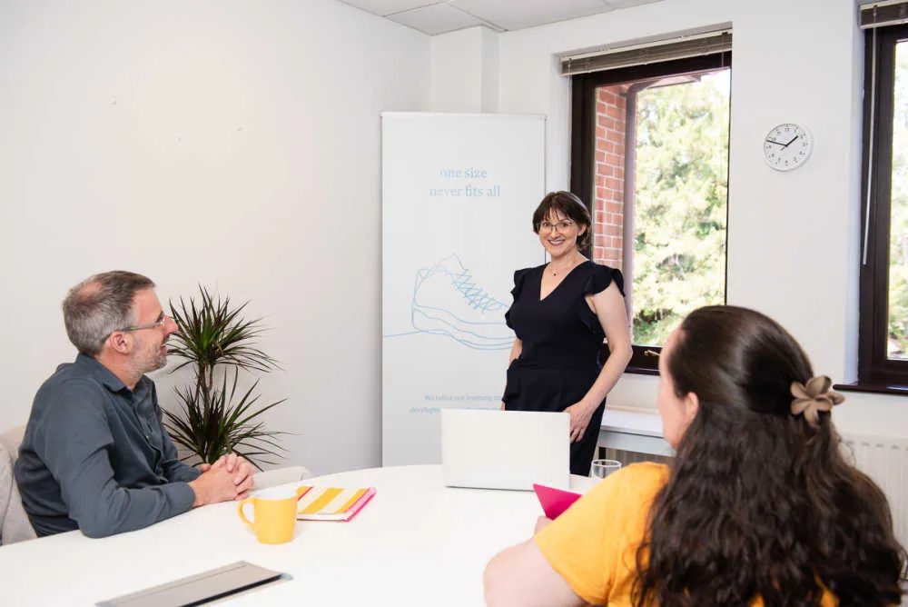 14 Advantages and disadvantages of teamwork: a practical guide with real examples 2 Elizabeth Harrin and team in a meeting